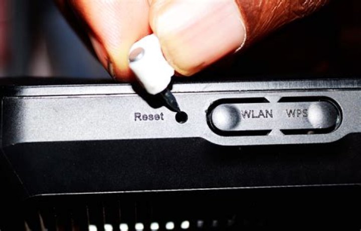 How do I use the reset button on my tablet?